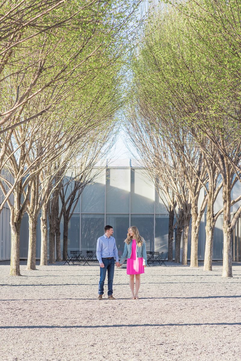 Beautiful pictures of an engagement session at the North Carolina Museum of Art, NCMA by Raleigh North Carolina wedding photographer, Mikkel Paige Photography. They brought their Golden Doodle dog for extra fun and we captured the Cherry Blossoms during a spring photoshoot. | Raleigh Engagement Photographer | #mikkelpaige #RaleighEngagementPhotographer #RaleighEngagementPhotographs