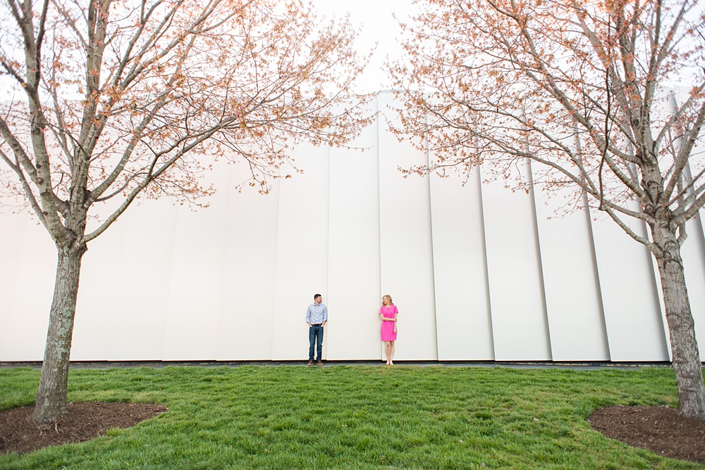 Beautiful pictures of an engagement session at the North Carolina Museum of Art, NCMA by Raleigh North Carolina wedding photographer, Mikkel Paige Photography. They brought their Golden Doodle dog for extra fun and we captured the Cherry Blossoms during a spring photoshoot. | Raleigh Engagement Photographer | #mikkelpaige #RaleighEngagementPhotographer #RaleighEngagementPhotographs