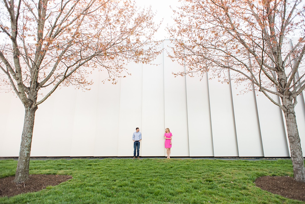 Beautiful pictures of an engagement session at the North Carolina Museum of Art, NCMA by Raleigh North Carolina wedding photographer, Mikkel Paige Photography. They brought their Golden Doodle dog for extra fun and we captured the Cherry Blossoms during a spring photoshoot. | Raleigh Engagement Photographer | #mikkelpaige #RaleighEngagementPhotographer #RaleighEngagementPhotographs