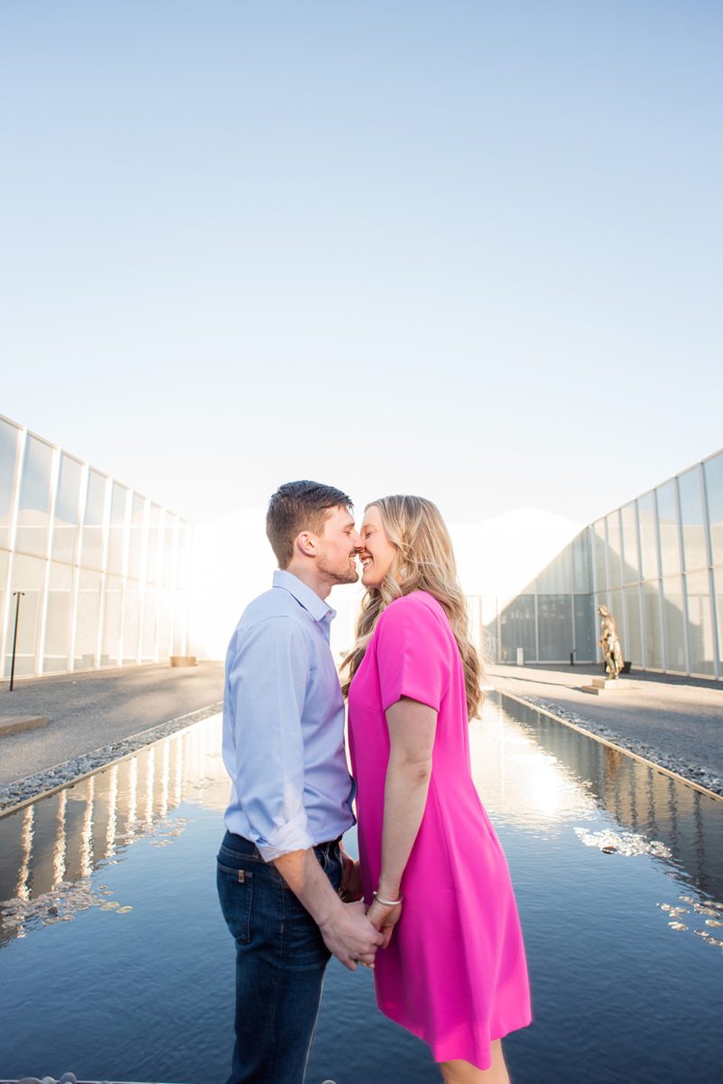 Beautiful pictures of an engagement session at the North Carolina Museum of Art, NCMA by Raleigh North Carolina wedding photographer, Mikkel Paige Photography. They brought their Golden Doodle dog for extra fun and we captured the Cherry Blossoms during a spring photoshoot. | Raleigh Engagement Photographer | #mikkelpaige #RaleighEngagementPhotographer #RaleighEngagementPhotographs