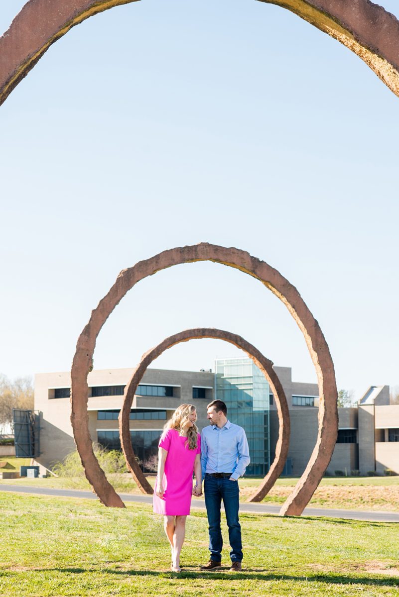 Beautiful pictures of an engagement session at the North Carolina Museum of Art, NCMA by Raleigh North Carolina wedding photographer, Mikkel Paige Photography. They brought their Golden Doodle dog for extra fun and we captured the Cherry Blossoms during a spring photoshoot. | Raleigh Engagement Photographer | #mikkelpaige #RaleighEngagementPhotographer #RaleighEngagementPhotographs