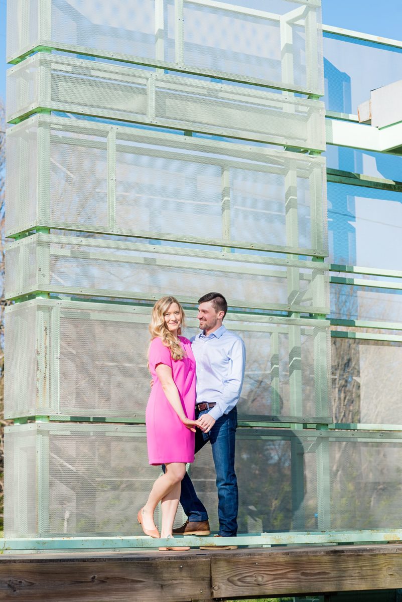 Beautiful pictures of an engagement session at the North Carolina Museum of Art, NCMA by Raleigh North Carolina wedding photographer, Mikkel Paige Photography. They brought their Golden Doodle dog for extra fun and we captured the Cherry Blossoms during a spring photoshoot. | Raleigh Engagement Photographer | #mikkelpaige #RaleighEngagementPhotographer #RaleighEngagementPhotographs