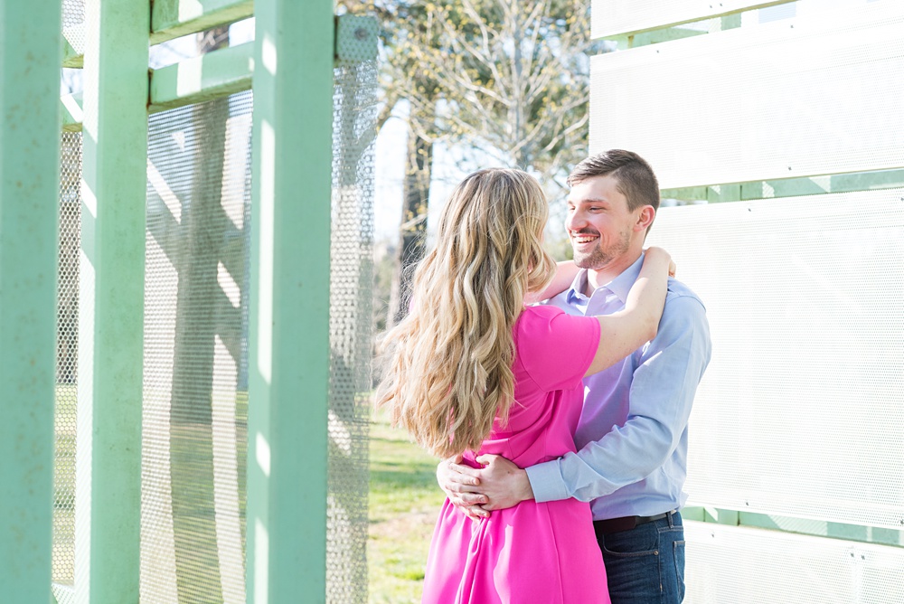 Beautiful pictures of an engagement session at the North Carolina Museum of Art, NCMA by Raleigh North Carolina wedding photographer, Mikkel Paige Photography. They brought their Golden Doodle dog for extra fun and we captured the Cherry Blossoms during a spring photoshoot. | Raleigh Engagement Photographer | #mikkelpaige #RaleighEngagementPhotographer #RaleighEngagementPhotographs