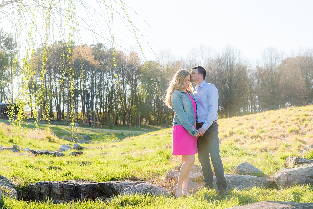 Beautiful pictures of an engagement session at the North Carolina Museum of Art, NCMA by Raleigh North Carolina wedding photographer, Mikkel Paige Photography. They brought their Golden Doodle dog for extra fun and we captured the Cherry Blossoms during a spring photoshoot. | Raleigh Engagement Photographer | #mikkelpaige #RaleighEngagementPhotographer #RaleighEngagementPhotographs