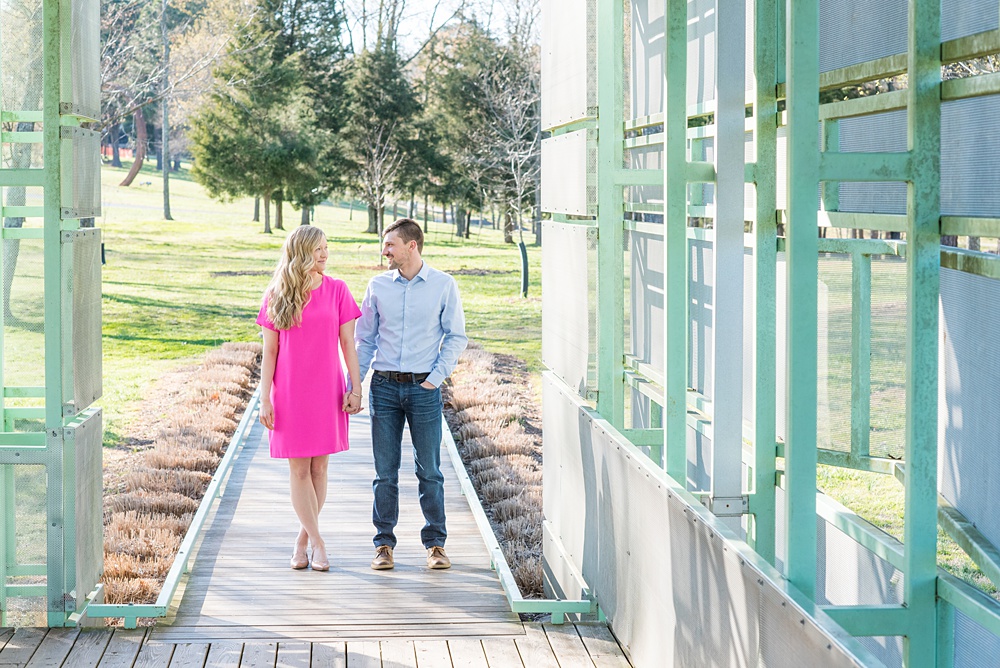 Beautiful pictures of an engagement session at the North Carolina Museum of Art, NCMA by Raleigh North Carolina wedding photographer, Mikkel Paige Photography. They brought their Golden Doodle dog for extra fun and we captured the Cherry Blossoms during a spring photoshoot. | Raleigh Engagement Photographer | #mikkelpaige #RaleighEngagementPhotographer #RaleighEngagementPhotographs