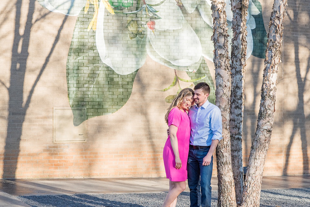 Beautiful pictures of an engagement session at the North Carolina Museum of Art, NCMA by Raleigh North Carolina wedding photographer, Mikkel Paige Photography. They brought their Golden Doodle dog for extra fun and we captured the Cherry Blossoms during a spring photoshoot. | Raleigh Engagement Photographer | #mikkelpaige #RaleighEngagementPhotographer #RaleighEngagementPhotographs