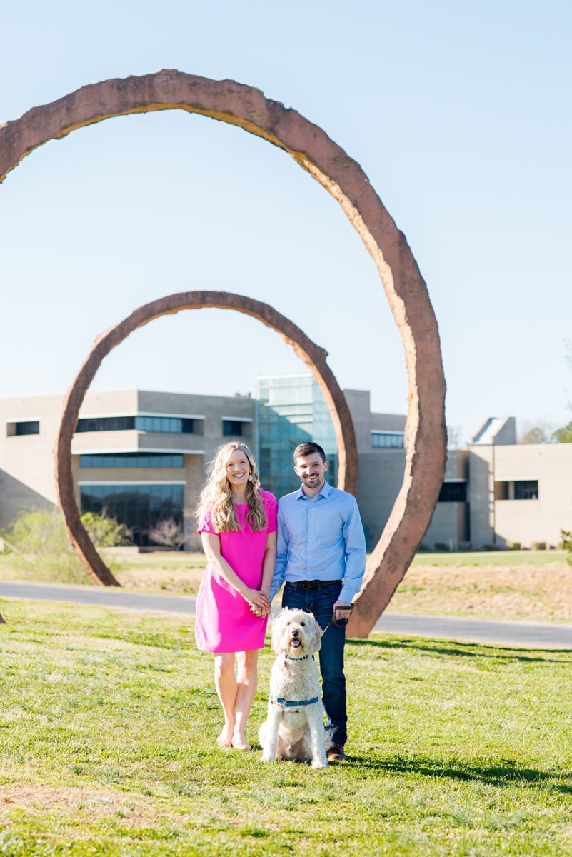 Beautiful pictures of an engagement session at the North Carolina Museum of Art, NCMA by Raleigh North Carolina wedding photographer, Mikkel Paige Photography. They brought their Golden Doodle dog for extra fun and we captured the Cherry Blossoms during a spring photoshoot. | Raleigh Engagement Photographer | #mikkelpaige #RaleighEngagementPhotographer #RaleighEngagementPhotographs