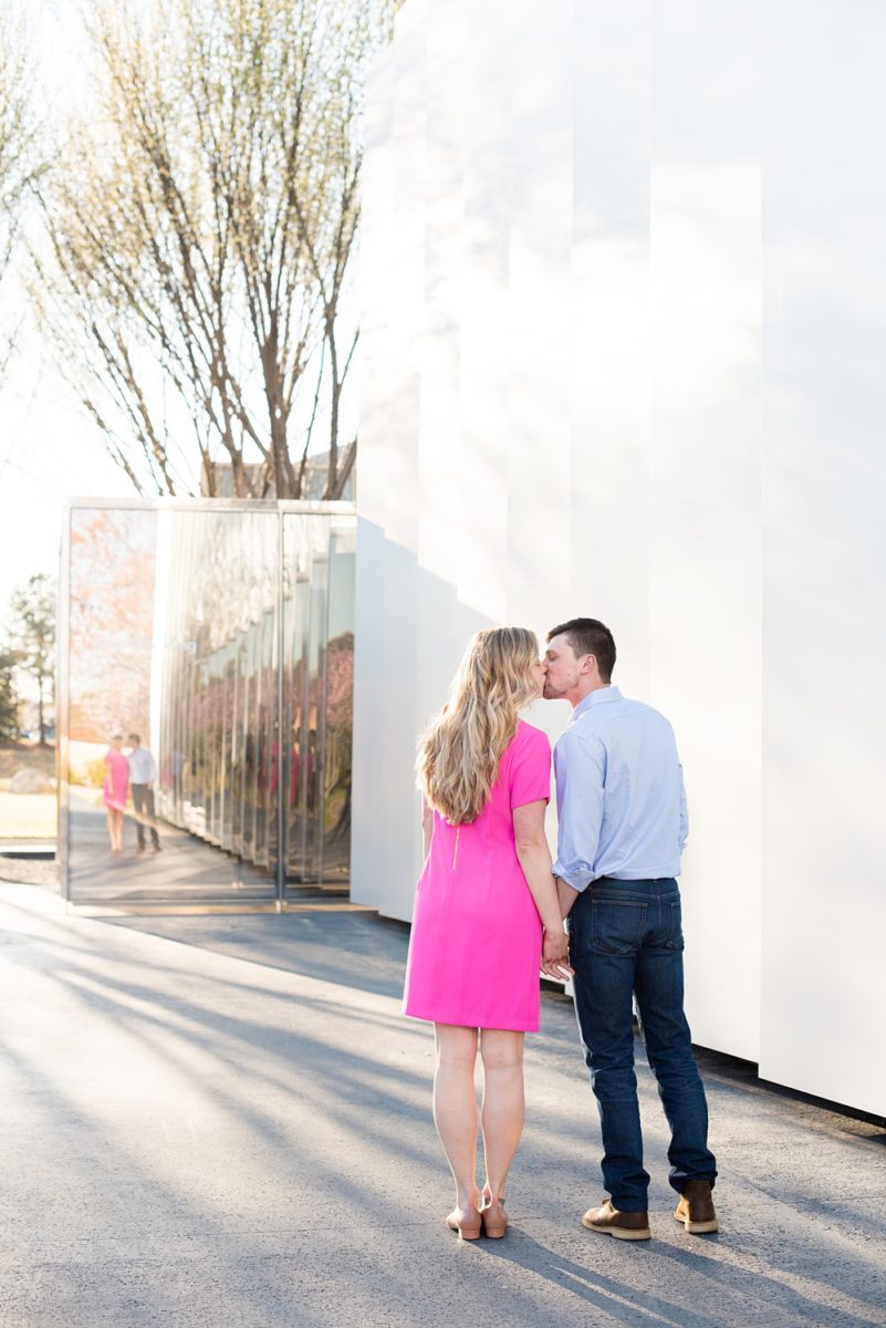 Beautiful pictures of an engagement session at the North Carolina Museum of Art, NCMA by Raleigh North Carolina wedding photographer, Mikkel Paige Photography. They brought their Golden Doodle dog for extra fun and we captured the Cherry Blossoms during a spring photoshoot. | Raleigh Engagement Photographer | #mikkelpaige #RaleighEngagementPhotographer #RaleighEngagementPhotographs