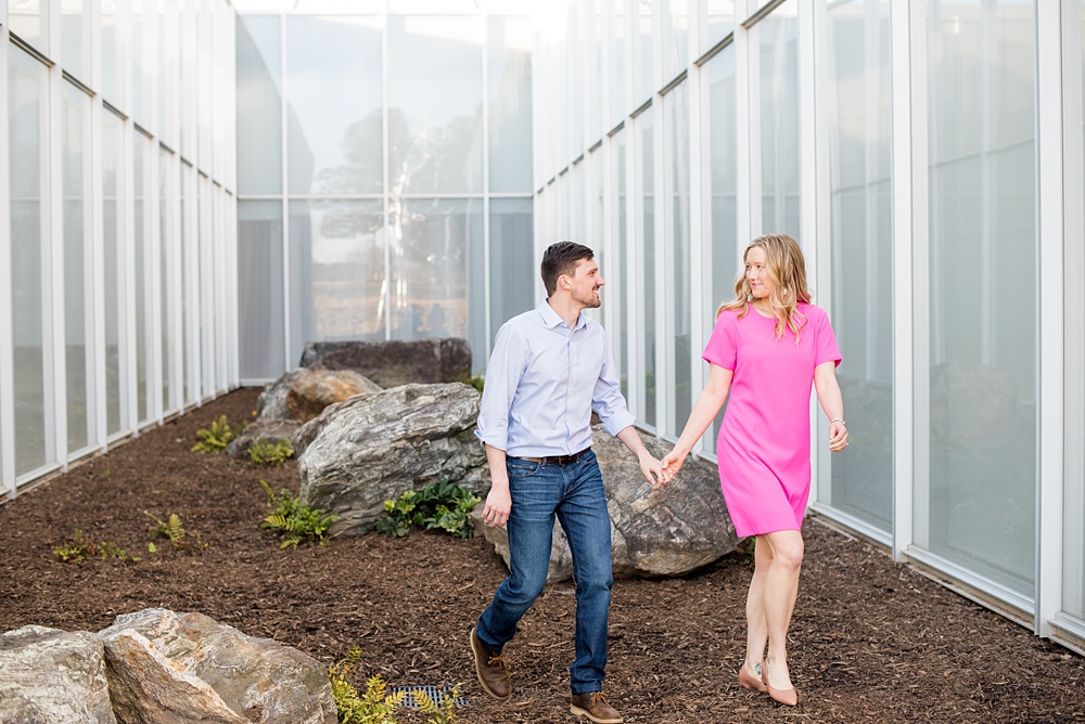 Beautiful pictures of an engagement session at the North Carolina Museum of Art, NCMA by Raleigh North Carolina wedding photographer, Mikkel Paige Photography. They brought their Golden Doodle dog for extra fun and we captured the Cherry Blossoms during a spring photoshoot. | Raleigh Engagement Photographer | #mikkelpaige #RaleighEngagementPhotographer #RaleighEngagementPhotographs