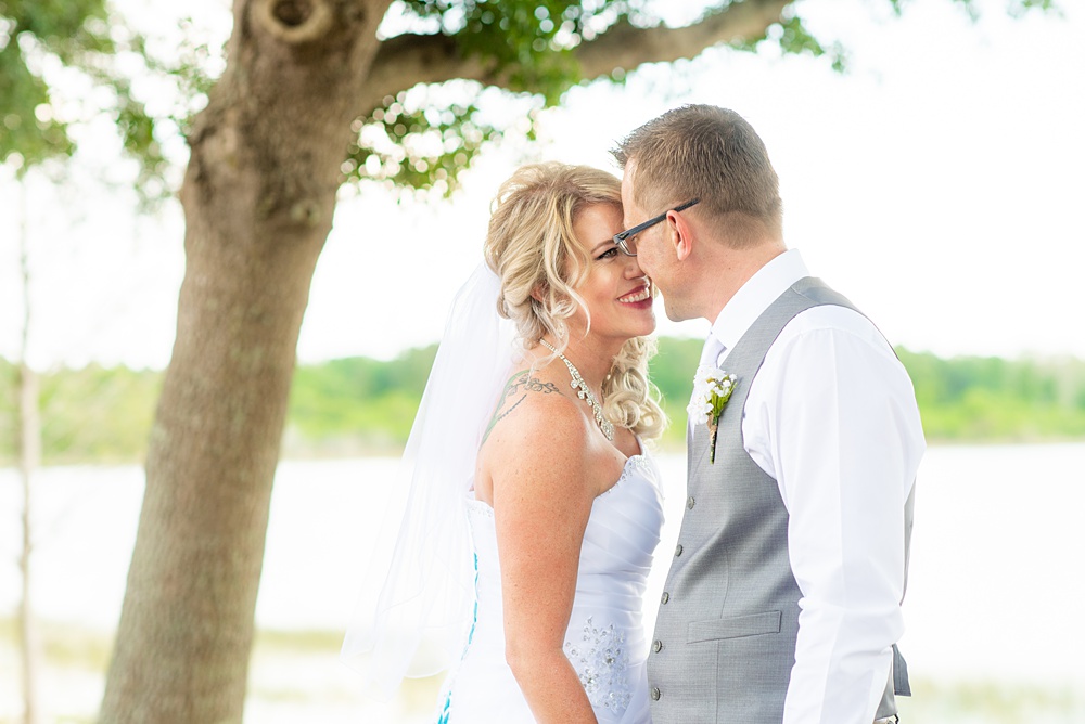 Hub 925 wedding photos at an alternative Orlando wedding venue by Mikkel Paige Photography. The bride and groom kiss near Little Sand Lake near Universal theme park. #mikkelpaige #hub925 #orlandoweddingphotographer #orlandoweddingphotos #floridaweddingphotographer #centralfloridawedding #orlandoweddingvenue