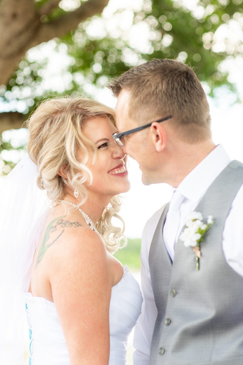 Hub 925 wedding photos at an alternative Orlando wedding venue by Mikkel Paige Photography. The bride and groom kiss near Little Sand Lake near Universal theme park. #mikkelpaige #hub925 #orlandoweddingphotographer #orlandoweddingphotos #floridaweddingphotographer #centralfloridawedding #orlandoweddingvenue