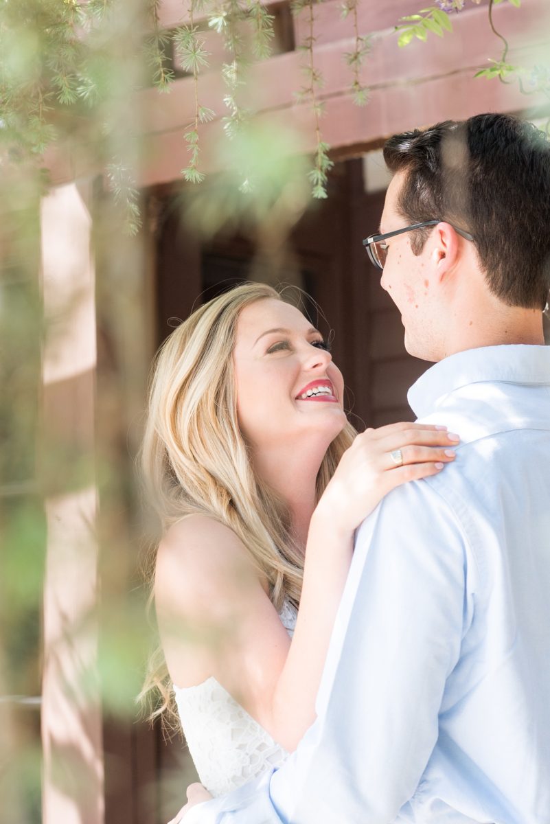 Duke Gardens engagement photos in Durham, North Carolina, by Mikkel Paige Photography. Trees with leaves in full bloom during spring reveal themselves for a May session. #DurhamPhotographer #DurhamWeddingPhotographer #SarahPDukeGardens #DukeGardens #DurhamEngagementSession