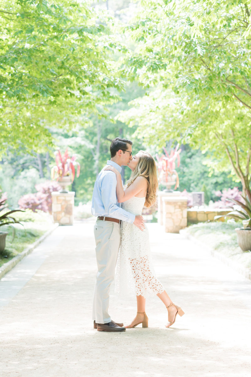 Duke Gardens engagement photos in Durham, North Carolina, by Mikkel Paige Photography. Trees with leaves in full bloom during spring reveal themselves for a May session. #DurhamPhotographer #DurhamWeddingPhotographer #SarahPDukeGardens #DukeGardens #DurhamEngagementSession