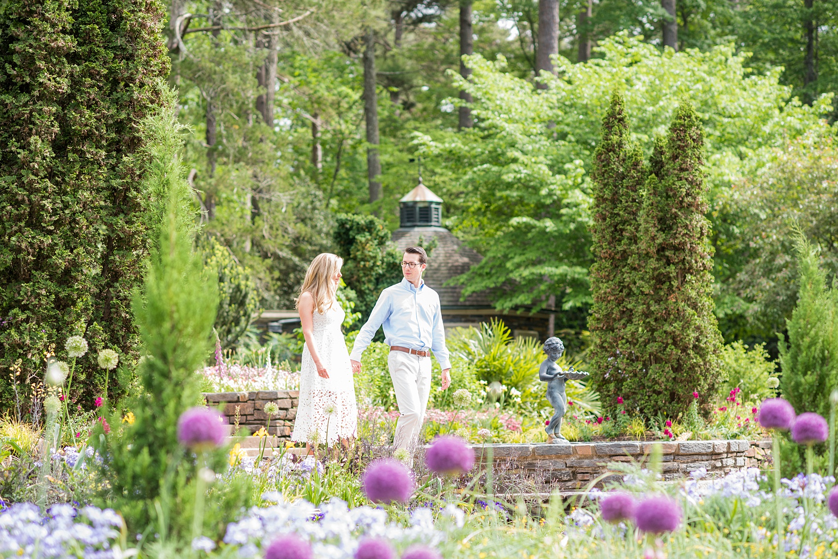 Duke Gardens engagement photos in Durham, North Carolina, by Mikkel Paige Photography. Trees with leaves in full bloom during spring reveal themselves for a May session. #DurhamPhotographer #DurhamWeddingPhotographer #SarahPDukeGardens #DukeGardens #DurhamEngagementSession