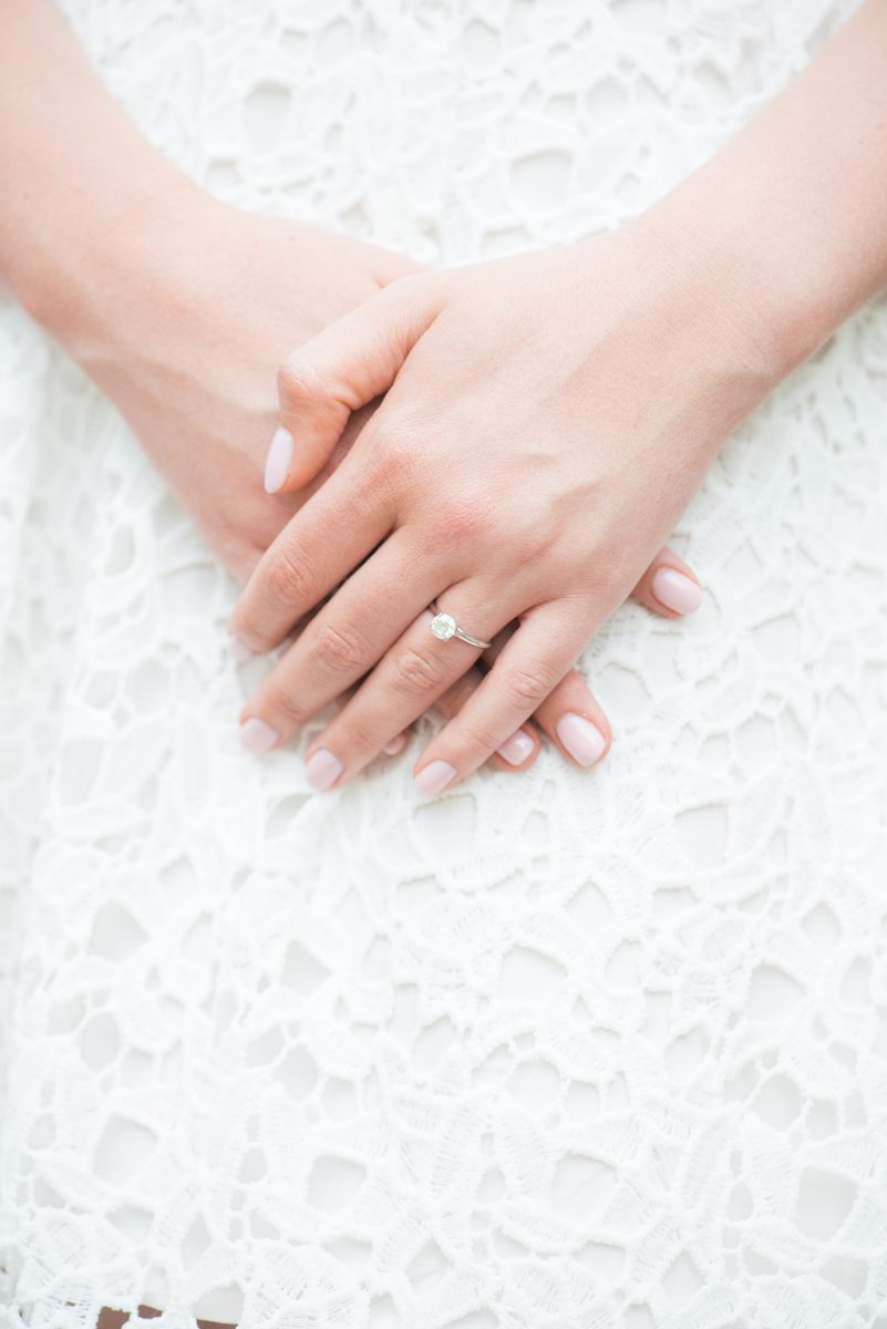 Duke Gardens engagement photos in Durham, North Carolina, by Mikkel Paige Photography. Trees with leaves in full bloom during spring reveal themselves for a May session. #DurhamPhotographer #DurhamWeddingPhotographer #SarahPDukeGardens #DukeGardens #DurhamEngagementSession #diamondring #shesaidyes #engagementring