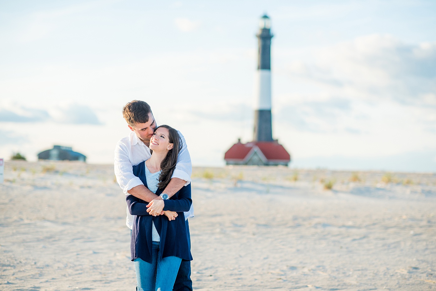 Beautiful Long Island engagement photos on the beach with a lighthouse. Mikkel Paige Photography captured the couple at Robert Moses state park in New York, just 40 minutes from NYC. #mikkelpaige #LongIslandEngagement #LongIslandBeachEngagement #Beachweddingphotos #LongIslandphotographer #LongIslandWeddingPhotographer