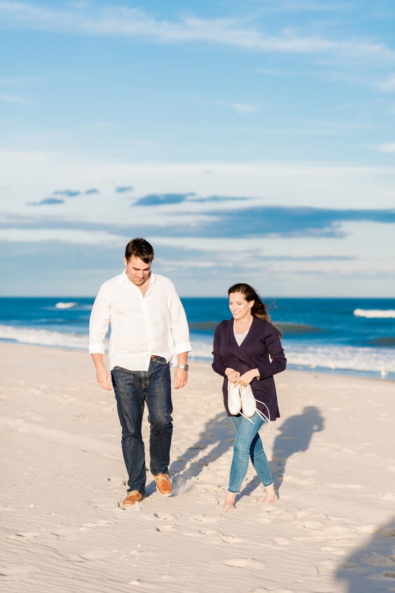 Beautiful Long Island engagement photos on the beach with a lighthouse. Mikkel Paige Photography captured the couple at Robert Moses state park in New York, just 40 minutes from NYC. #mikkelpaige #LongIslandEngagement #LongIslandBeachEngagement #Beachweddingphotos #LongIslandphotographer #LongIslandWeddingPhotographer