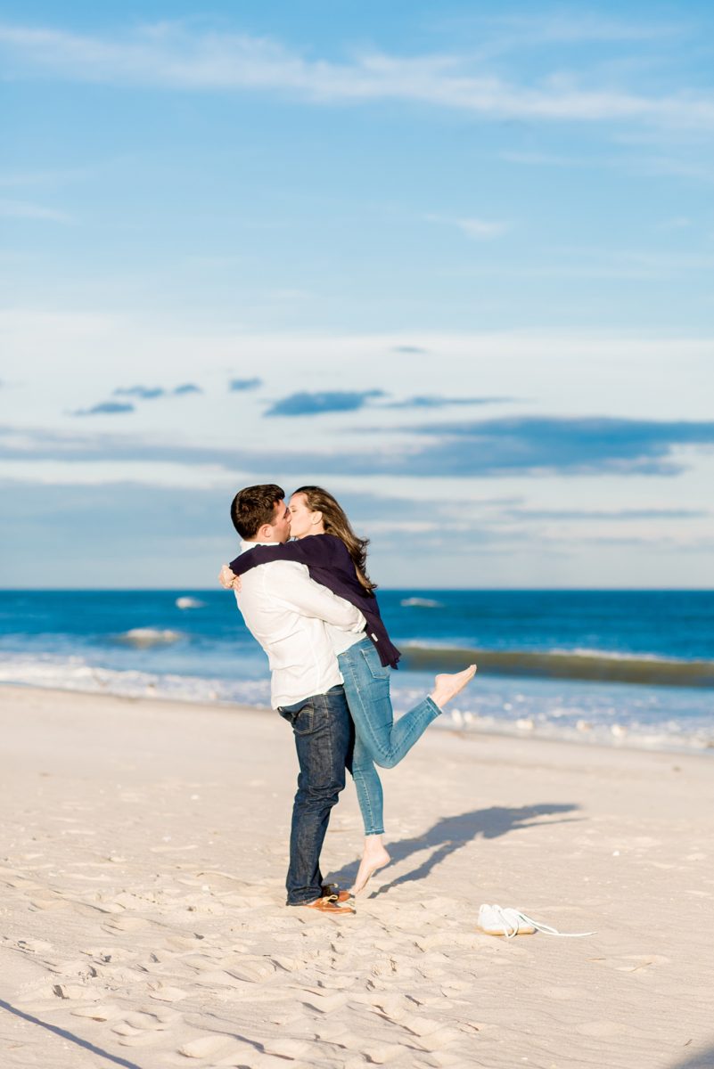 Beautiful Long Island engagement photos on the beach with a lighthouse. Mikkel Paige Photography captured the couple at Robert Moses state park in New York, just 40 minutes from NYC. #mikkelpaige #LongIslandEngagement #LongIslandBeachEngagement #Beachweddingphotos #LongIslandphotographer #LongIslandWeddingPhotographer