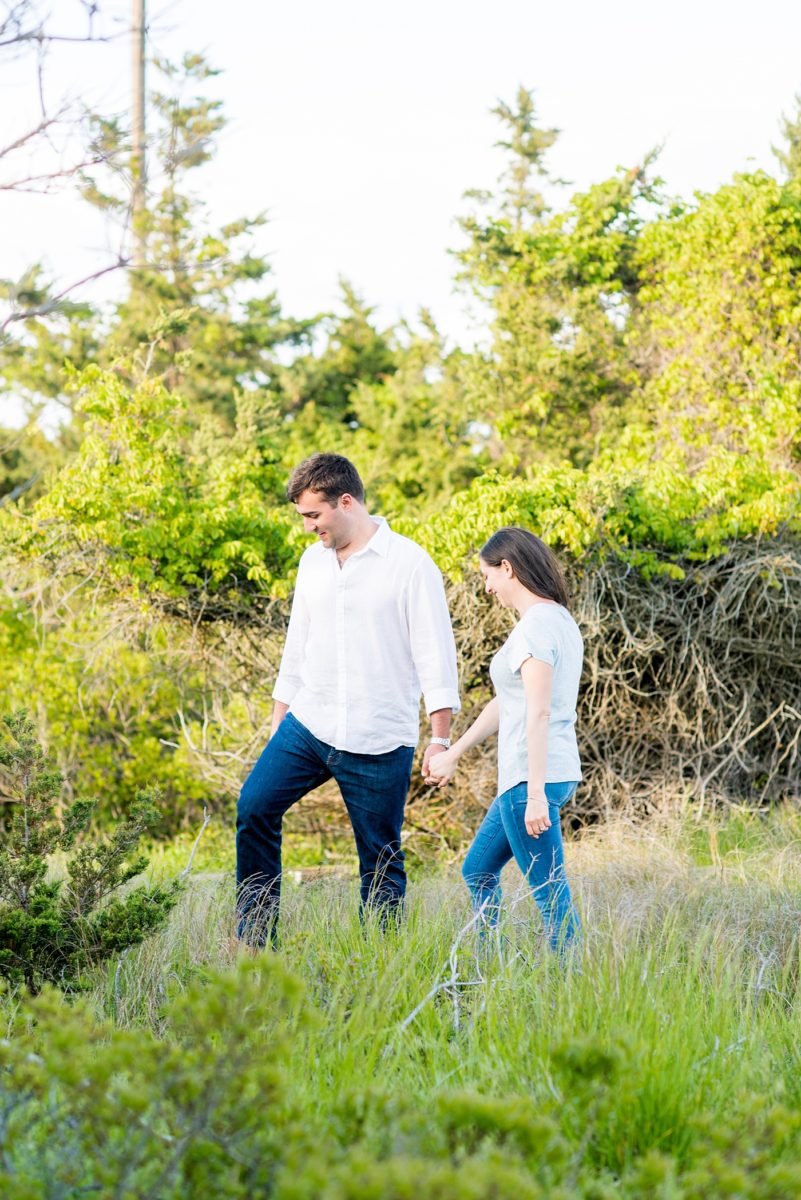 Beautiful Long Island engagement photos on the beach with a lighthouse. Mikkel Paige Photography captured the couple at Robert Moses state park in New York, just 40 minutes from NYC. #mikkelpaige #LongIslandEngagement #LongIslandBeachEngagement #Beachweddingphotos #LongIslandphotographer #LongIslandWeddingPhotographer