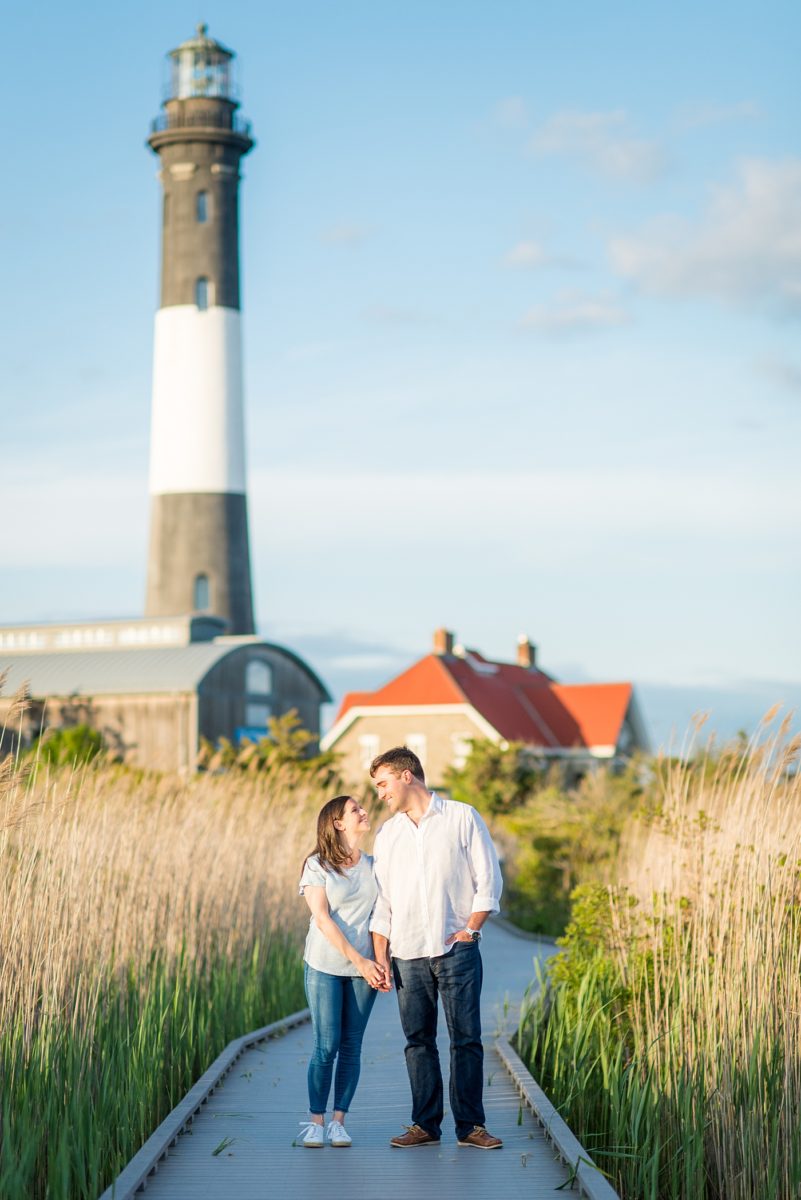 Beautiful Long Island engagement photos on the beach with a lighthouse. Mikkel Paige Photography captured the couple at Robert Moses state park in New York, just 40 minutes from NYC. #mikkelpaige #LongIslandEngagement #LongIslandBeachEngagement #Beachweddingphotos #LongIslandphotographer #LongIslandWeddingPhotographer