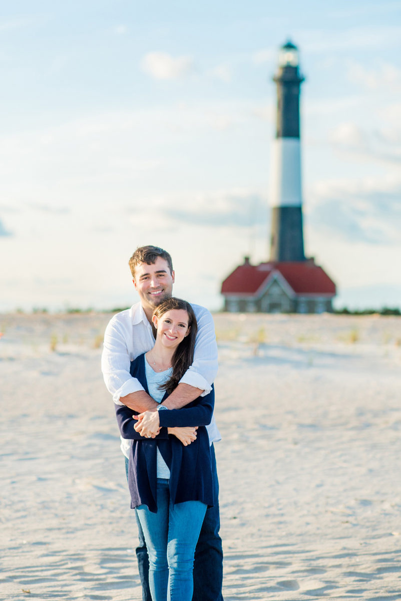 Beautiful Long Island engagement photos on the beach with a lighthouse. Mikkel Paige Photography captured the couple at Robert Moses state park in New York, just 40 minutes from NYC. #mikkelpaige #LongIslandEngagement #LongIslandBeachEngagement #Beachweddingphotos #LongIslandphotographer #LongIslandWeddingPhotographer