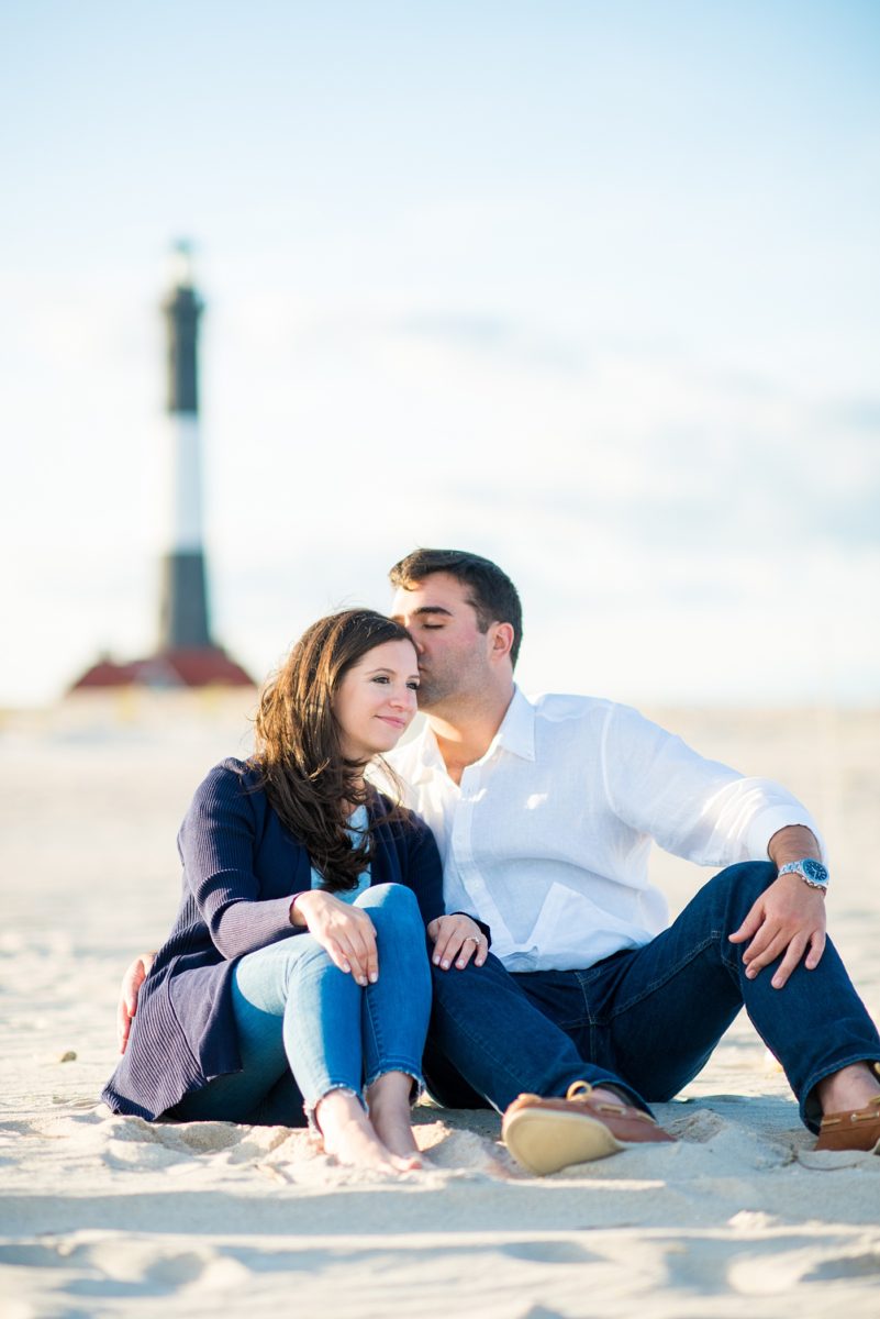 Beautiful Long Island engagement photos on the beach with a lighthouse. Mikkel Paige Photography captured the couple at Robert Moses state park in New York, just 40 minutes from NYC. #mikkelpaige #LongIslandEngagement #LongIslandBeachEngagement #Beachweddingphotos #LongIslandphotographer #LongIslandWeddingPhotographer