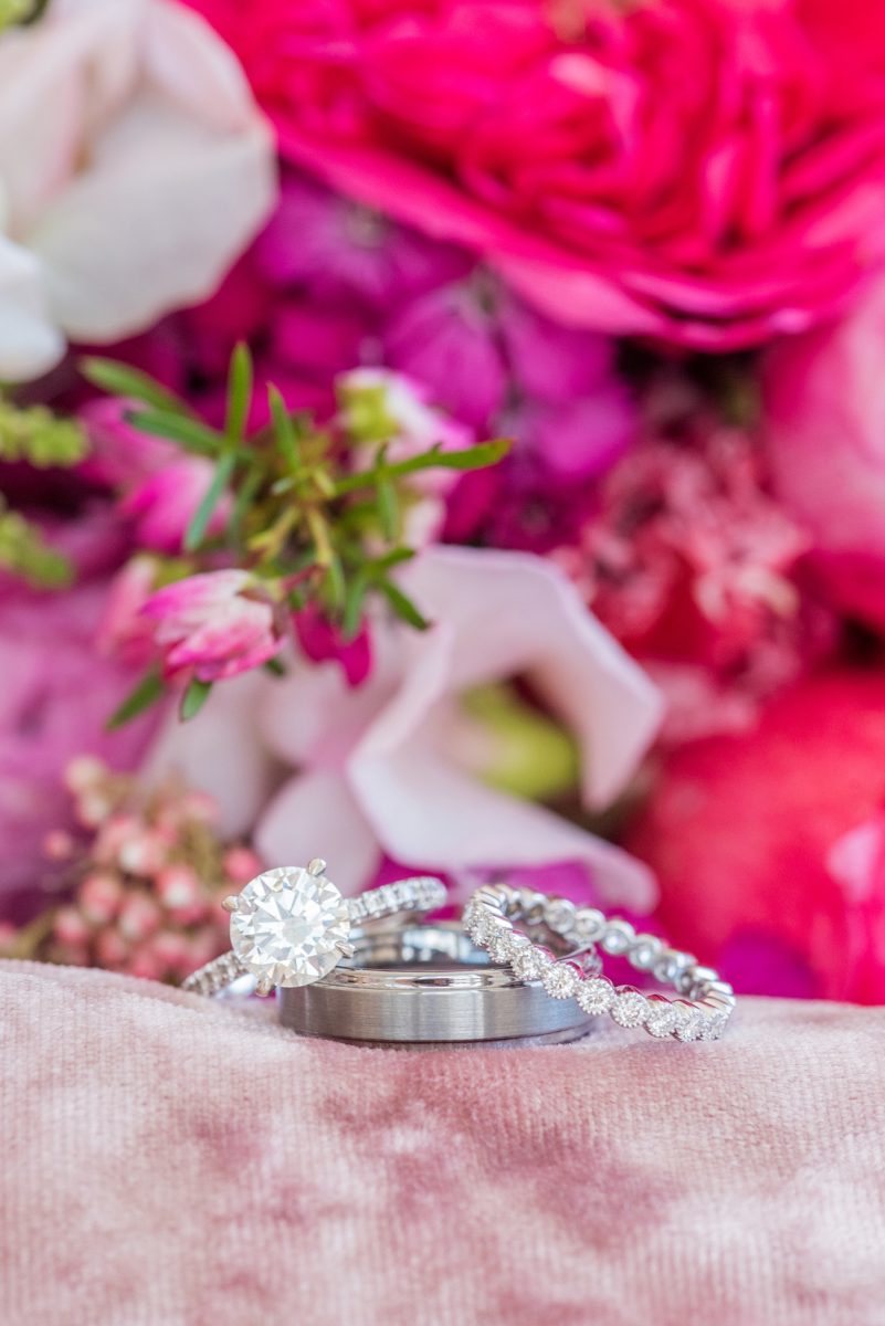 A beautiful spring wedding in downtown Raleigh, North Carolina, at the event venue, The Stockroom at 230 and The Glass Box. Their photographer, Mikkel Paige Photography, captured beautiful ring detail images and wedding portraits, and bridal pictures of their hot pink and aqua blue colors. #MikkelPaige #DowntownRaleigh #RaleighWedding #RaleighVenue #TheStockroomat230