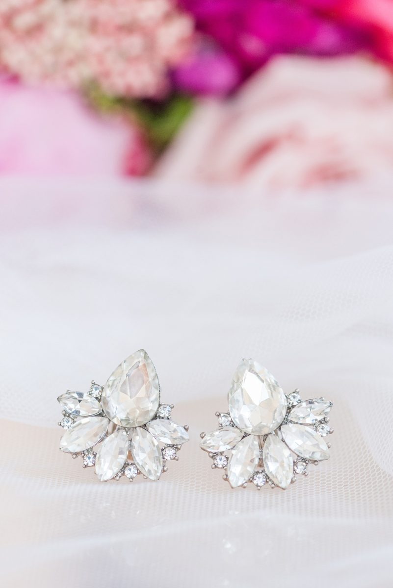 A beautiful spring wedding in downtown Raleigh, North Carolina, at the event venue, The Stockroom at 230 and The Glass Box. Their photographer, Mikkel Paige Photography, captured beautiful detail images of the bride’s earrings for a pink palette wedding. #MikkelPaige #DowntownRaleigh #RaleighWedding #RaleighVenue #TheStockroomat230 #weddingearrings