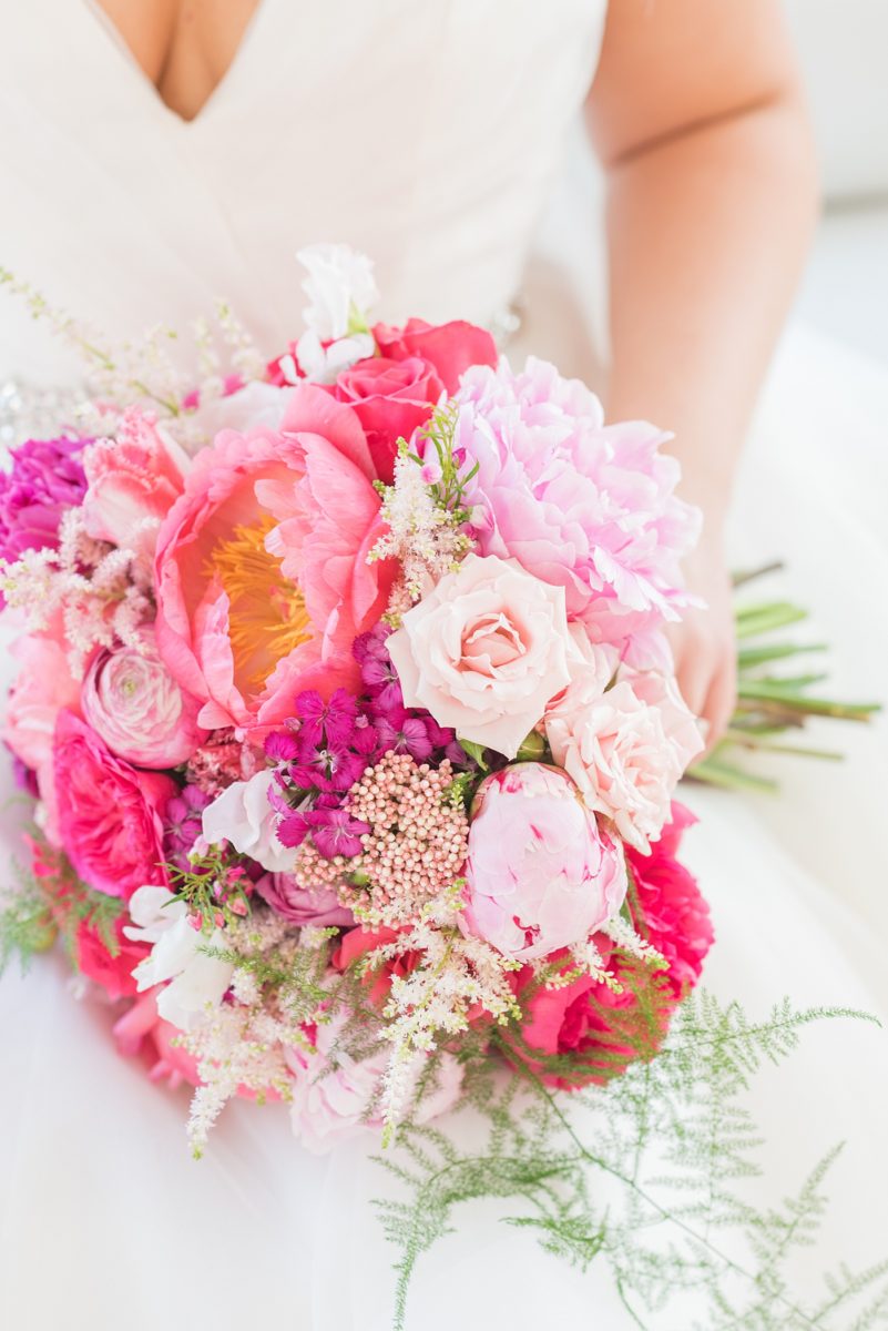 A beautiful spring wedding in Raleigh, North Carolina, at the event venue, The Stockroom at 230 and The Glass Box. Their photographer, Mikkel Paige Photography, captured inspiring bride and groom wedding portraits at the capital building downtown. Their hot pink and aqua colors and peony bouquet perfect for May. #MikkelPaige #DowntownRaleigh #RaleighWedding #RaleighVenue #TheStockroomat230 #theenglishgardenraleigh