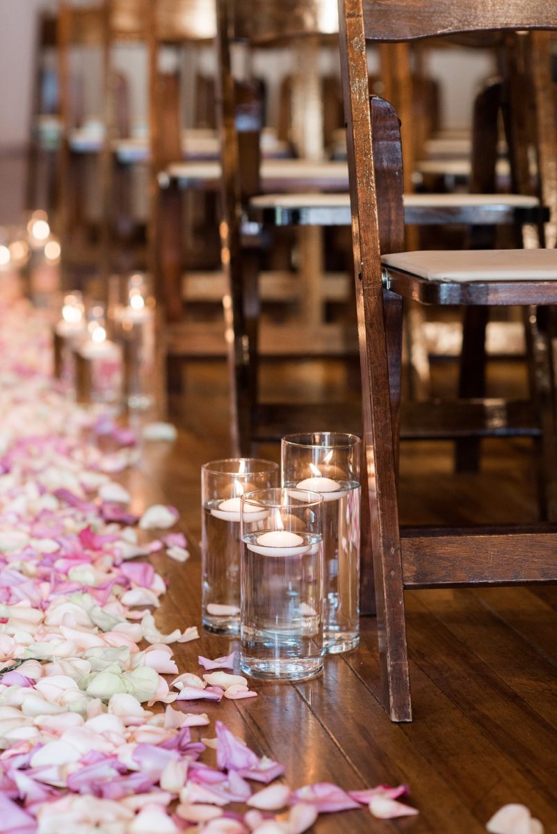 Indoor spring wedding ceremony at the event venue The Stockroom at 230 in Raleigh, North Carolina. Their photographer, Mikkel Paige Photography, captured the bride and groom’s vows in this historic building near the capital downtown. #MikkelPaige #DowntownRaleigh #RaleighWedding #RaleighVenue #TheStockroomat230 #weddingceremony #indoorweddingceremony