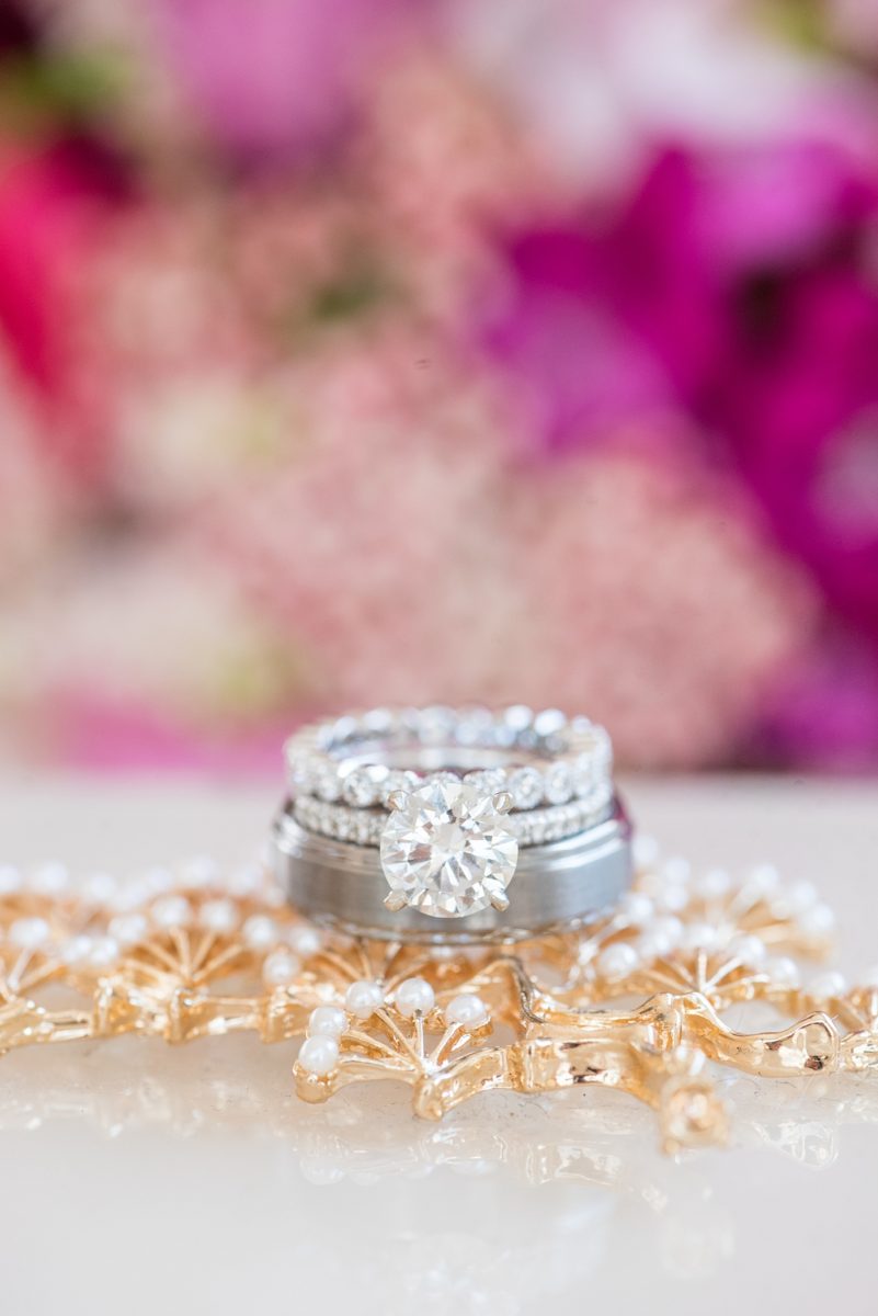 A beautiful spring wedding in downtown Raleigh, North Carolina, at the event venue, The Stockroom at 230 and The Glass Box. Their photographer, Mikkel Paige Photography, captured beautiful ring detail images and wedding portraits, and bridal pictures of their hot pink and aqua blue colors. #MikkelPaige #DowntownRaleigh #RaleighWedding #RaleighVenue #TheStockroomat230