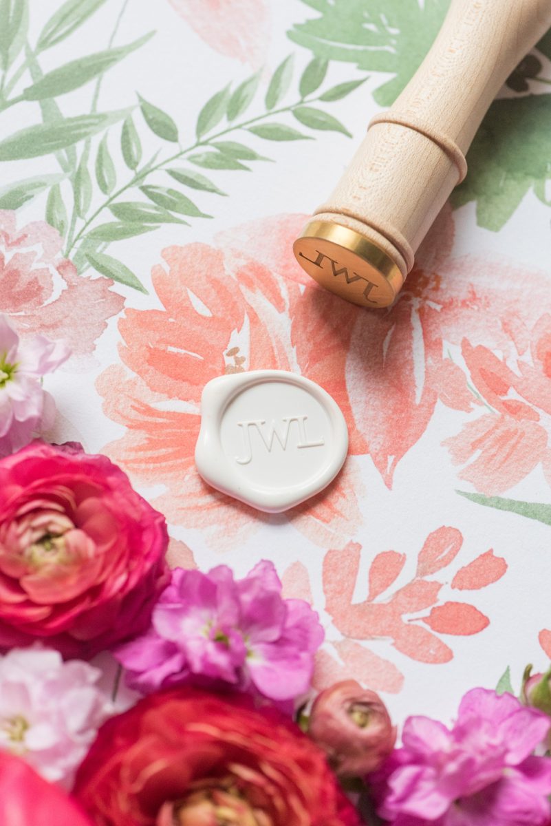 Floral watercolor wedding stationery and wax seal for invitations for a spring wedding in downtown Raleigh, North Carolina at the event venue The Stockroom at 230. Their photographer, Mikkel Paige Photography, captured this lay flat of their hot pink and aqua watercolor by @OneandOnlyPaper and white monogram wax seal. #MikkelPaige #DowntownRaleigh #RaleighWedding #RaleighVenue #TheStockroomat230 #floralwatercolorinvitation #weddinginvitation #oopaper #oneandonlypaper #layflatphotography #waxseal