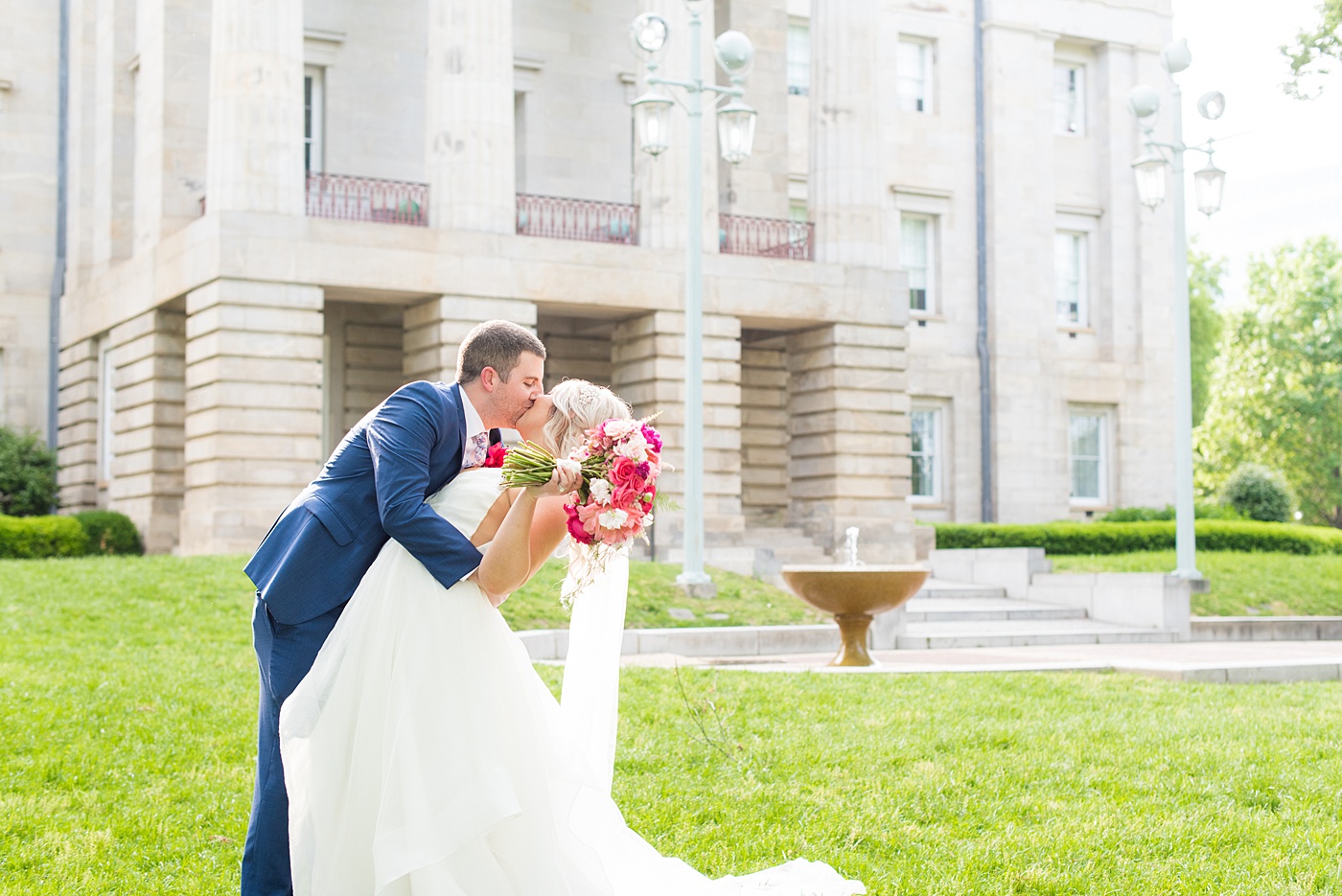 Beautiful spring wedding in downtown Raleigh, North Carolina, at the event venue The Stockroom at 230 and The Glass Box. Their photographer, Mikkel Paige Photography, captured inspiring bride and groom portraits at the capital building with a hot pink peony bouquet by The English Garden. #MikkelPaige #DowntownRaleigh #RaleighWedding #RaleighVenue #TheStockroomat230 #hayleypaige #bridestyle