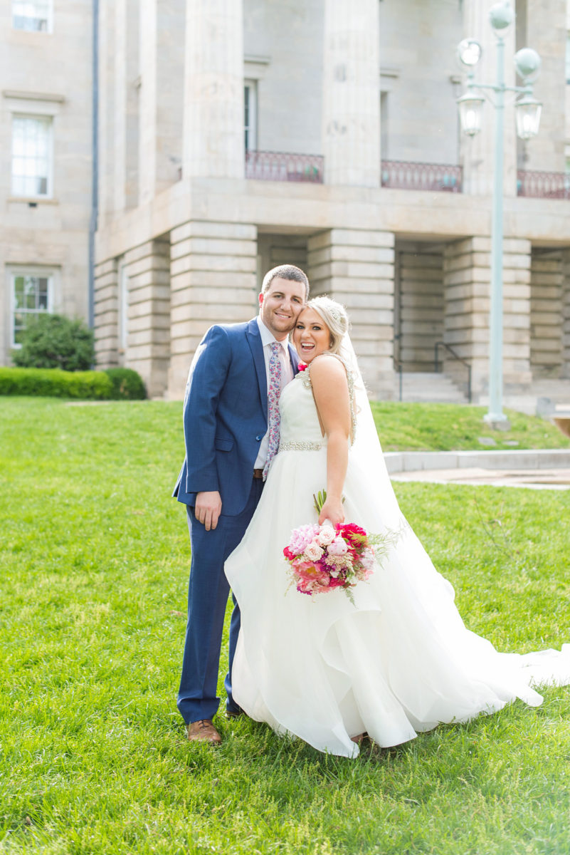 Beautiful spring wedding in downtown Raleigh, North Carolina, at the event venue The Stockroom at 230 and The Glass Box. Their photographer, Mikkel Paige Photography, captured inspiring bride and groom portraits at the capital building with a hot pink peony bouquet by The English Garden. #MikkelPaige #DowntownRaleigh #RaleighWedding #RaleighVenue #TheStockroomat230 #hayleypaige #bridestyle