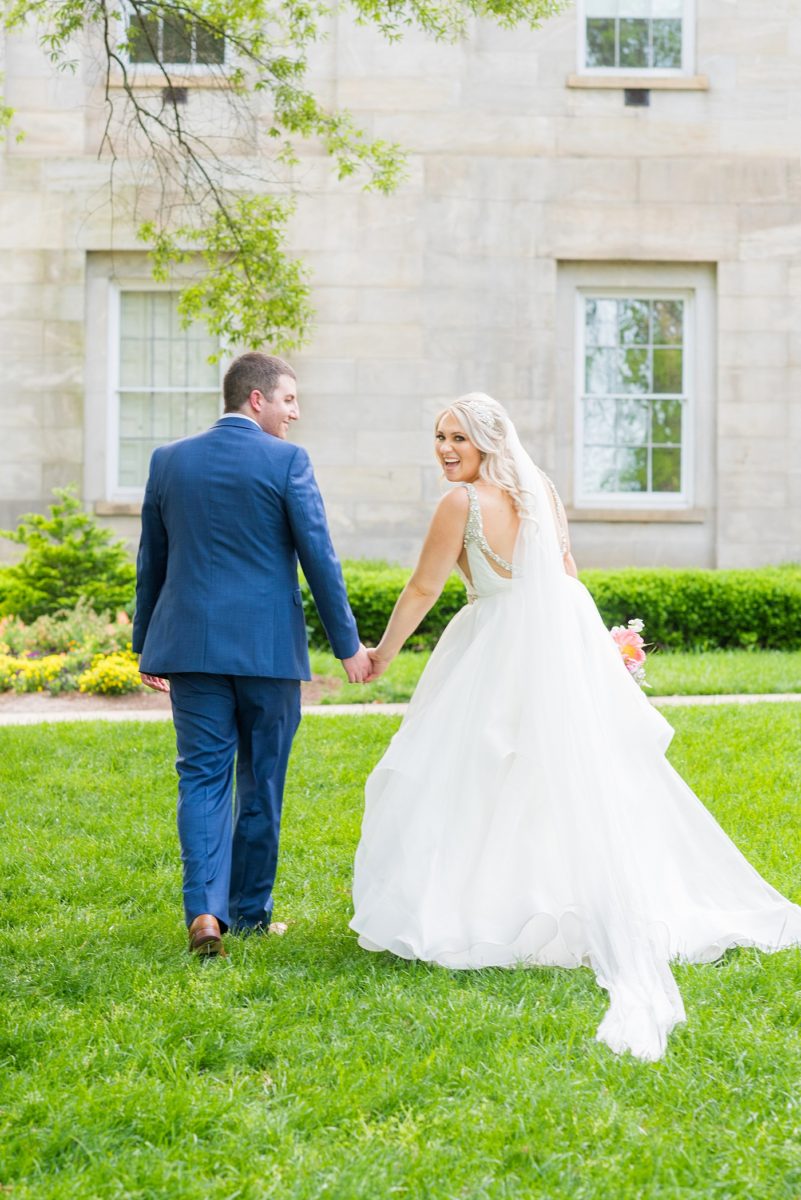 Beautiful spring wedding in downtown Raleigh, North Carolina, at the event venue The Stockroom at 230 and The Glass Box. Their photographer, Mikkel Paige Photography, captured inspiring bride and groom portraits at the capital building with a hot pink peony bouquet by The English Garden. #MikkelPaige #DowntownRaleigh #RaleighWedding #RaleighVenue #TheStockroomat230 #hayleypaige #bridestyle