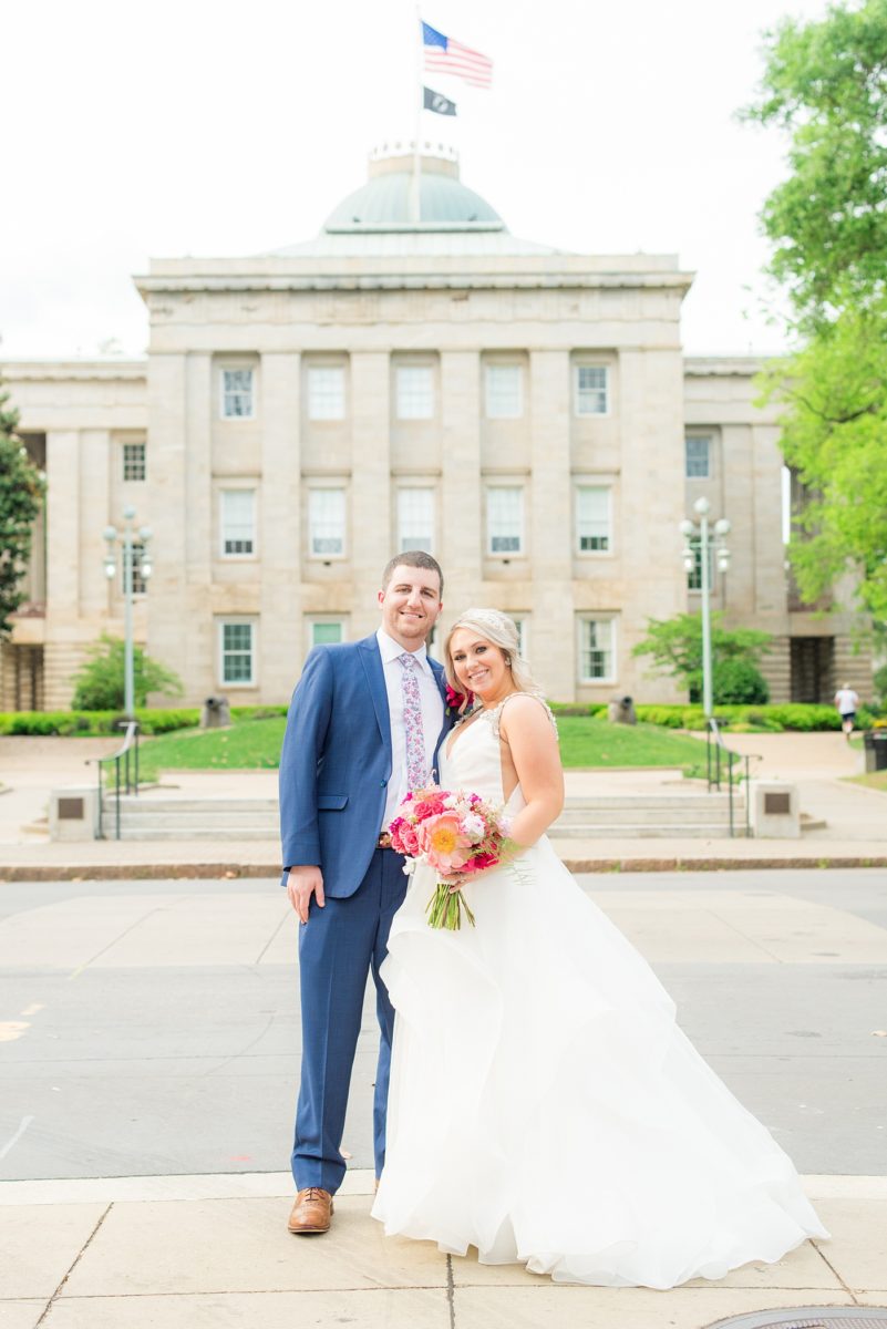 Beautiful spring wedding in downtown Raleigh, North Carolina, at the event venue The Stockroom at 230 and The Glass Box. Their photographer, Mikkel Paige Photography, captured inspiring bride and groom portraits at the capital building with a hot pink peony bouquet by The English Garden. #MikkelPaige #DowntownRaleigh #RaleighWedding #RaleighVenue #TheStockroomat230 #hayleypaige #bridestyle