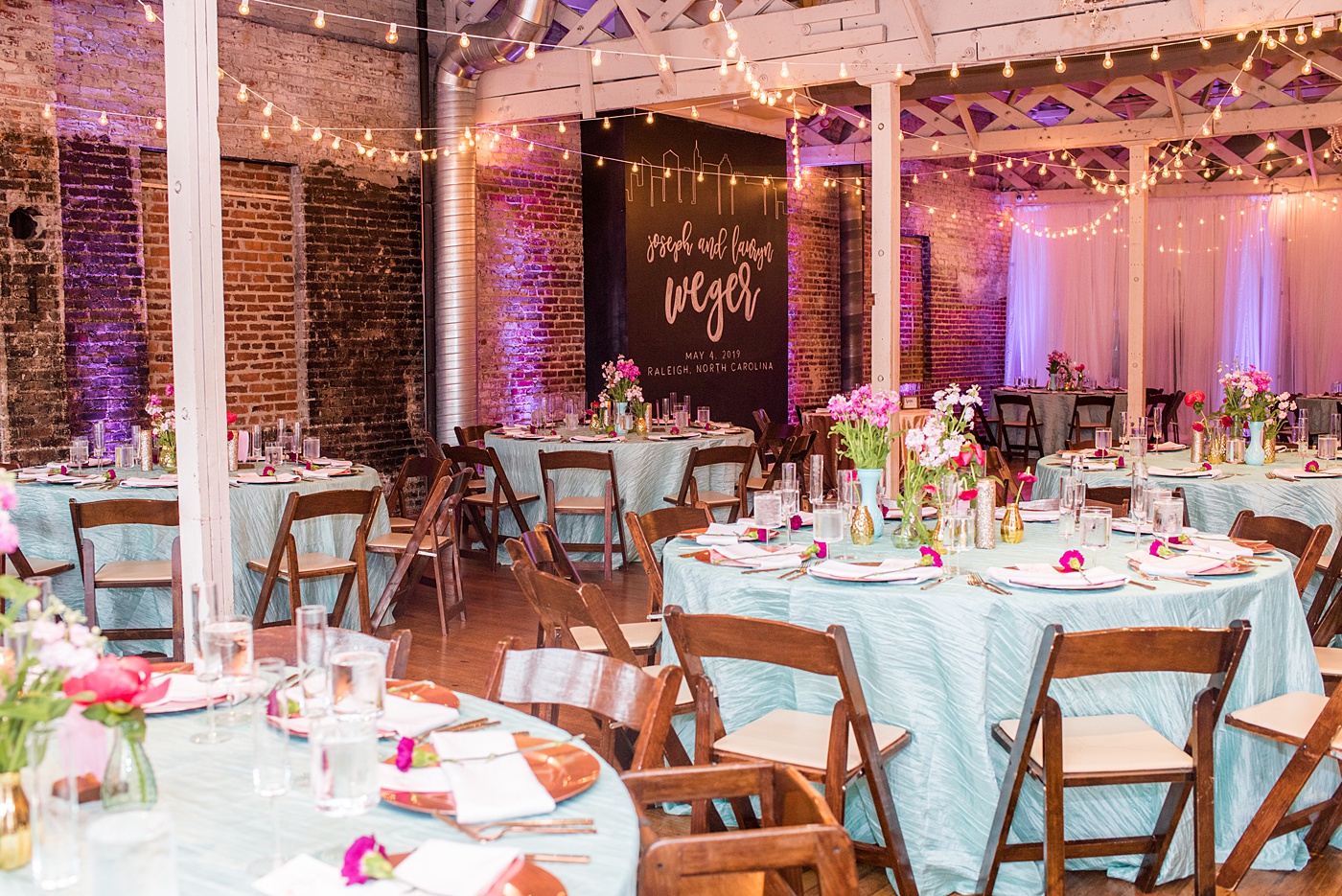 A beautiful spring wedding in downtown Raleigh, North Carolina, at the event venue The Stockroom at 230. Mikkel Paige Photography, their photographer, captured inspiring reception pictures of their hot pink and aqua blue colors. #MikkelPaige #DowntownRaleigh #RaleighWedding #RaleighVenue #TheStockroomat230 #weddingreception