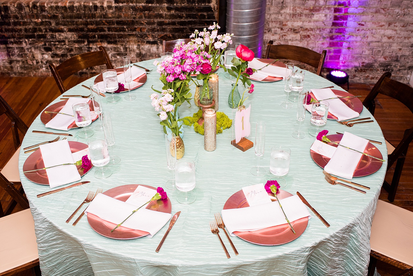 A beautiful spring wedding in downtown Raleigh, North Carolina, at the event venue The Stockroom at 230. Mikkel Paige Photography, their photographer, captured inspiring reception pictures of their hot pink and aqua blue colors. #MikkelPaige #DowntownRaleigh #RaleighWedding #RaleighVenue #TheStockroomat230 #weddingreception