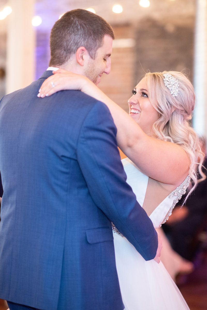 A beautiful spring wedding in downtown Raleigh, North Carolina, at the event venue The Stockroom at 230. Mikkel Paige Photography, their photographer, captured inspiring reception pictures of their hot pink and aqua blue colors. #MikkelPaige #DowntownRaleigh #RaleighWedding #RaleighVenue #TheStockroomat230 #weddingreception
