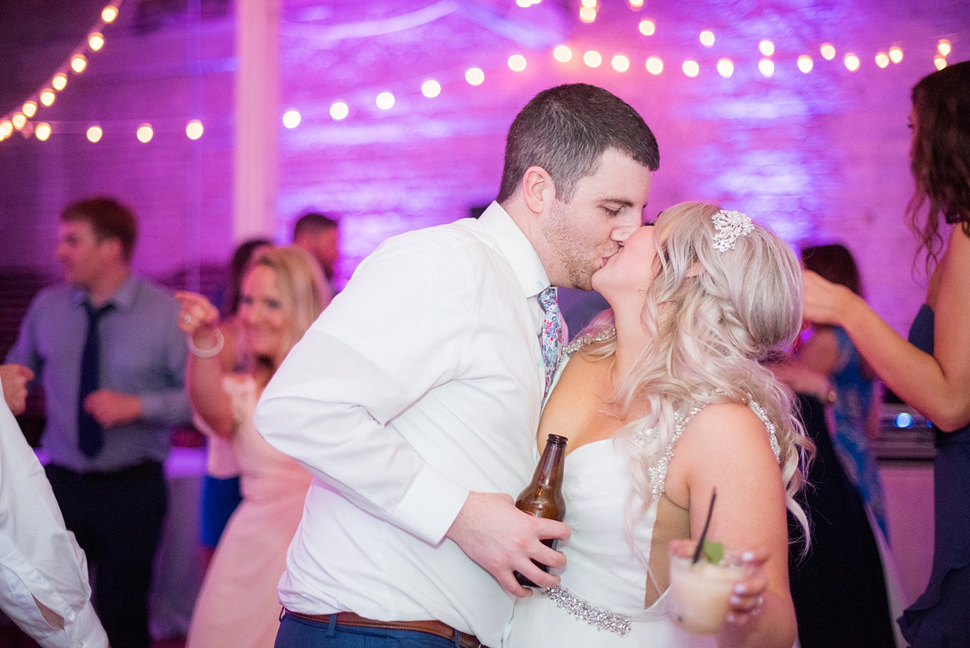 A beautiful spring wedding in downtown Raleigh, North Carolina, at the event venue The Stockroom at 230. Mikkel Paige Photography, their photographer, captured inspiring reception pictures of their hot pink and aqua blue colors. #MikkelPaige #DowntownRaleigh #RaleighWedding #RaleighVenue #TheStockroomat230 #weddingreception