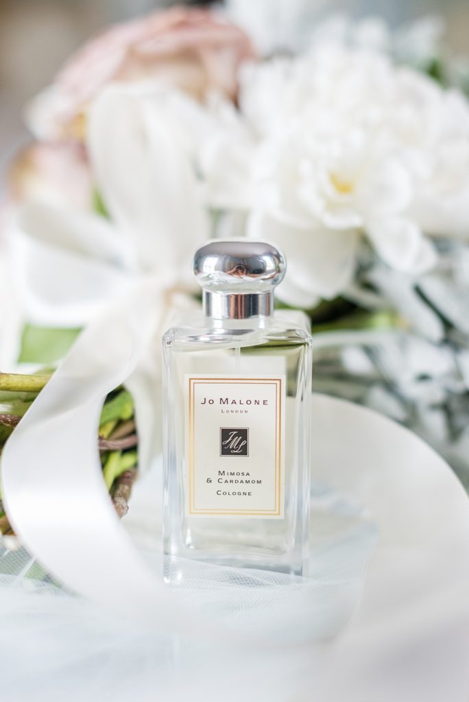 Westchester wedding photography at a beautiful outdoor and indoor venue called Crabtree's Kittle House. Photos by Mikkel Paige Photography. The bride had a special Jo Malone perfume scent for the day. #mikkelpaige #westchestervenue #westchesterphotography #crabtreeskittlehouse #bridestyle #Maywedding #brideperfume #weddingdetails