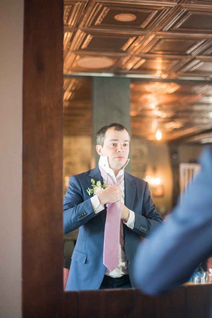 Westchester wedding photography at a beautiful outdoor and indoor venue called Crabtree's Kittle House. Photos by Mikkel Paige Photography. The groom wore a blue suit and black shoes, with a pink tie to compliment a purple and green wedding. #mikkelpaige #westchestervenue #westchesterphotography #crabtreeskittlehouse #groomsuit #Maywedding #weddingdetails #groomstyle