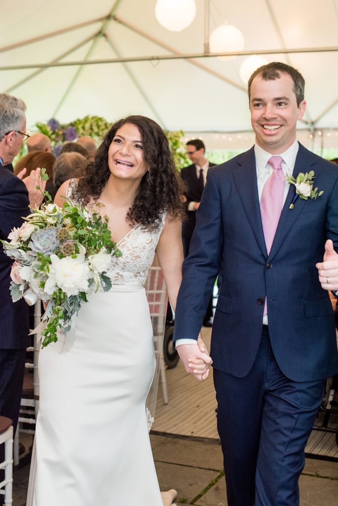 Westchester wedding photography at a beautiful outdoor and indoor venue called Crabtree's Kittle House. Photos by Mikkel Paige Photography. Their tented ceremony had Jewish traditions like breaking of a glass and their friend officiated. #mikkelpaige #westchestervenue #westchesterphotography #crabtreeskittlehouse #summerwedding #weddingceremony #weddingtent