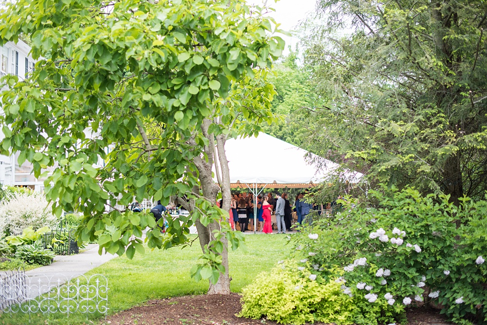 Pictures by Mikkel Paige Photography at the Westchester wedding venue, Crabtree's Kittle House. The ceremony was tented, photos outdoor and reception inside. Purple and white flowers with greenery were centerpieces in the intimate space including Pitcher Plants, ranunculus and roses and the cocktail hour was inside and outside in the tent. #mikkelpaige #westchestervenue #westchesterphotography #crabtreeskittlehouse #summerwedding #receptionspace #eventreception #purplewedding #purplepalette