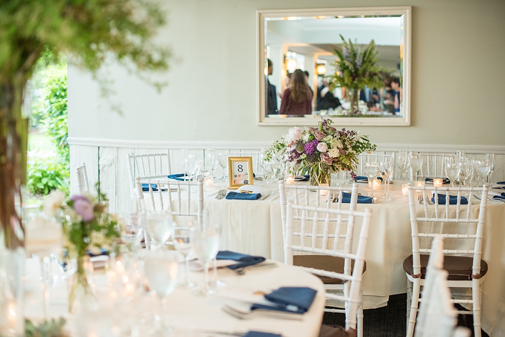 Pictures by Mikkel Paige Photography at the Westchester wedding venue, Crabtree's Kittle House. The ceremony was tented, photos outdoor and reception inside. Purple and white flowers with greenery were centerpieces in the intimate space including Pitcher Plants, ranunculus and roses. #mikkelpaige #westchestervenue #westchesterphotography #crabtreeskittlehouse #summerwedding #receptionspace #eventreception #purplewedding #purplepalette