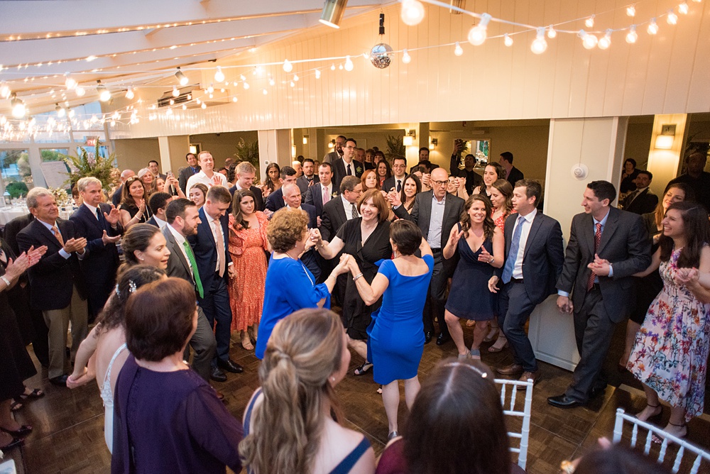 Pictures by Mikkel Paige Photography at the Westchester wedding venue, Crabtree's Kittle House. Family and friends met and talked during their tented cocktail hour and indoor reception dinner, throughout speeches and dancing to a Hank Lane live band. The couple had a purple palette for decorations. #mikkelpaige #westchestervenue #westchesterphotography #crabtreeskittlehouse #summerwedding #receptionspace #eventreception #purplewedding #purplepalette