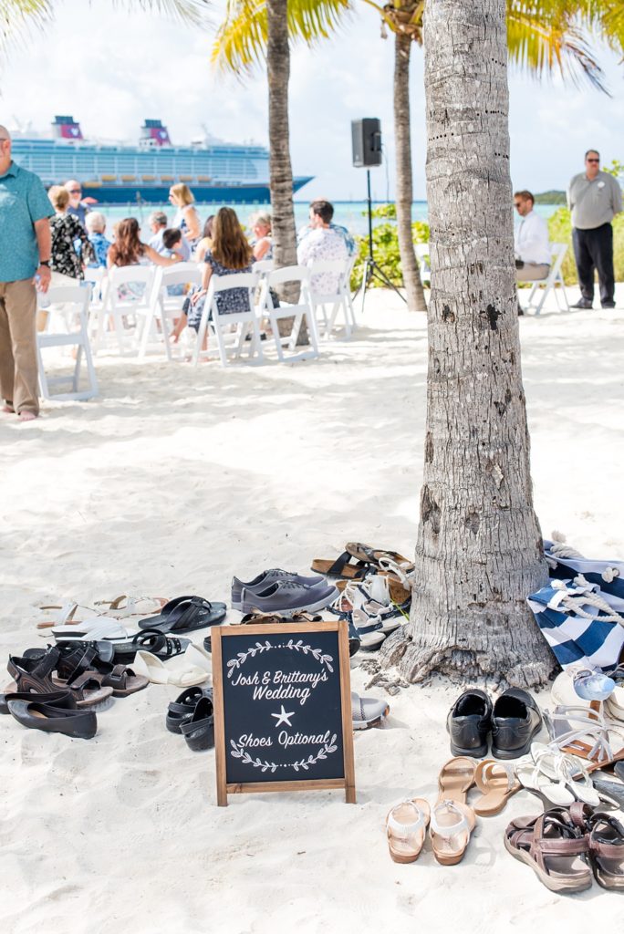 Disney Cruise Line destination wedding photos on Castaway Cay and the Disney Dream ship by Mikkel Paige Photography. This fairy tale wedding make the bride and groom's dream come true to get married in a fun location, spotlighting their love for the brand. Their ceremony was on the beach with the ship in the distance and aqua water nearby in the Bahamas. #mikkelpaige #disneywedding #disneyfairytalewedding #disneycruiseline #disneycruiselinewedding #disneydream #cruisewedding