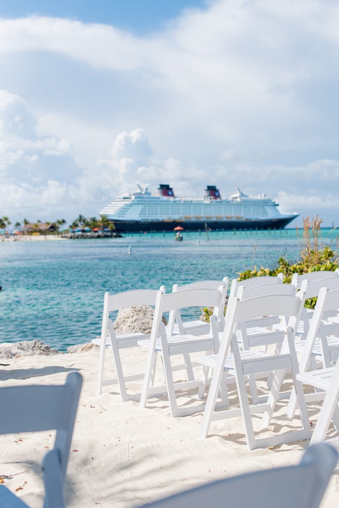 Disney Cruise Line destination wedding photos on Castaway Cay and the Disney Dream ship by Mikkel Paige Photography. This fairy tale wedding make the bride and groom's dream come true to get married in a fun location, spotlighting their love for the brand. Their ceremony was on the beach with the ship in the distance and aqua water nearby in the Bahamas. #mikkelpaige #disneywedding #disneyfairytalewedding #disneycruiseline #disneycruiselinewedding #disneydream #cruisewedding