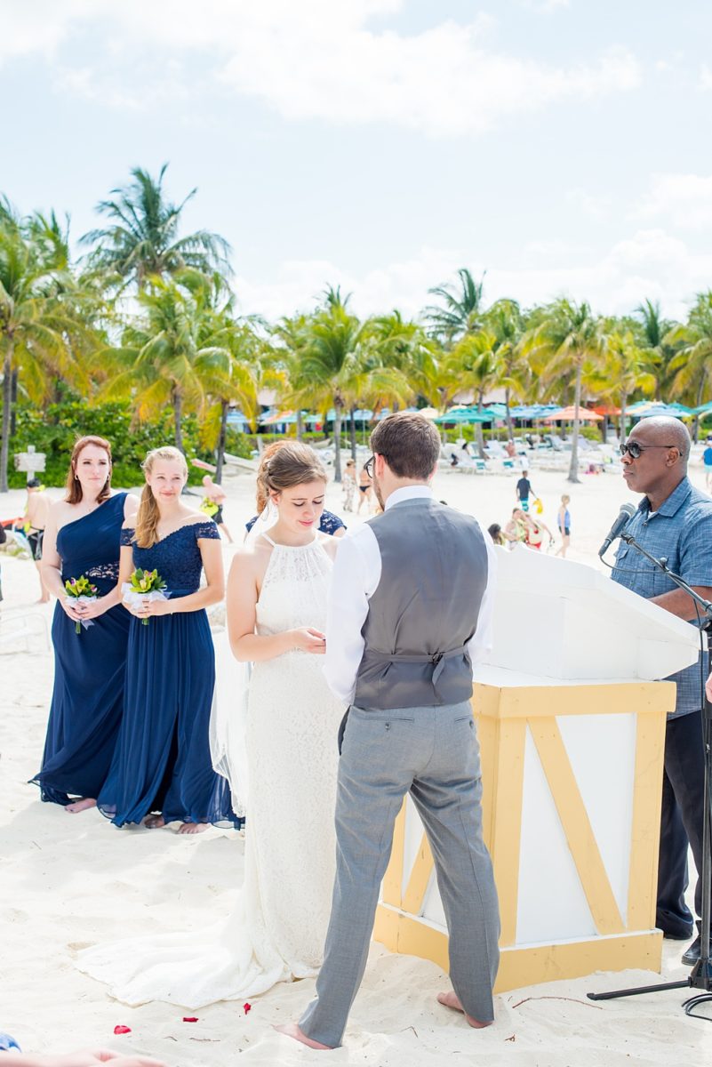 Disney Cruise Line destination wedding photos on Castaway Cay and the Disney Dream ship by Mikkel Paige Photography. This fairy tale wedding make the bride and groom's dream come true to get married in a fun location, spotlighting their love for the brand. Their ceremony was on the beach with the ship in the distance and aqua water nearby in the Bahamas. #mikkelpaige #disneywedding #disneyfairytalewedding #disneycruiseline #disneycruiselinewedding #disneydream #cruisewedding