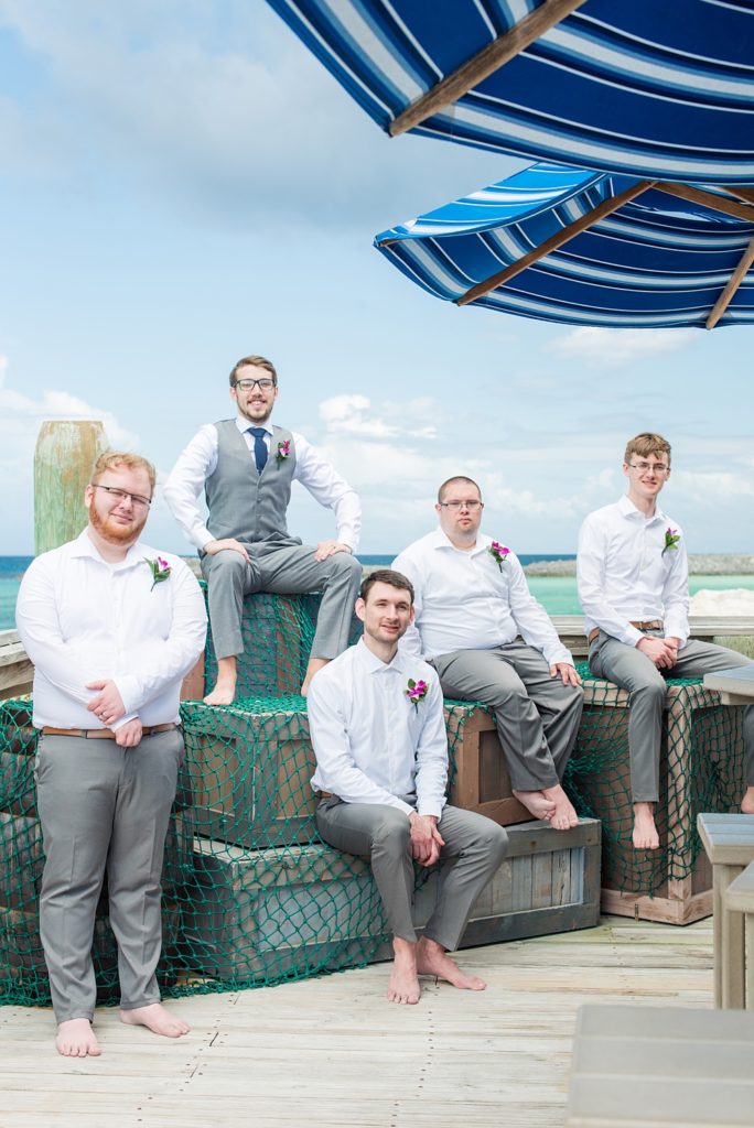 Disney Cruise Line destination wedding photos on Castaway Cay and the Disney Dream ship by Mikkel Paige Photography. This fairy tale wedding make the bride and groom's dream come true to get married in a fun location, spotlighting their love for the brand. Their ceremony was on the beach with the ship in the distance and aqua water nearby in the Bahamas. #mikkelpaige #disneywedding #disneyfairytalewedding #disneycruiseline #disneycruiselinewedding #disneydream #cruisewedding